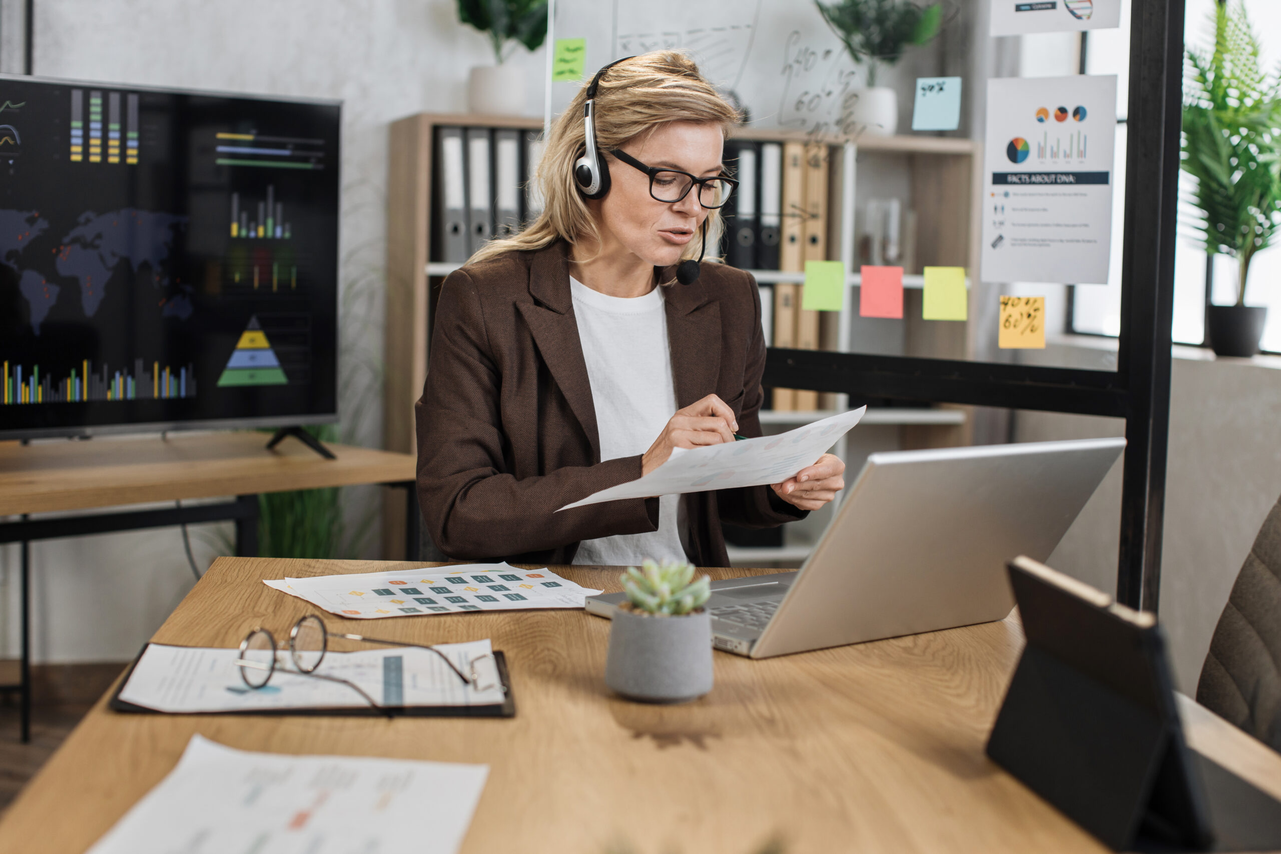 Shopify developer reviewing store analytics and performance charts during a virtual client consultation call.
