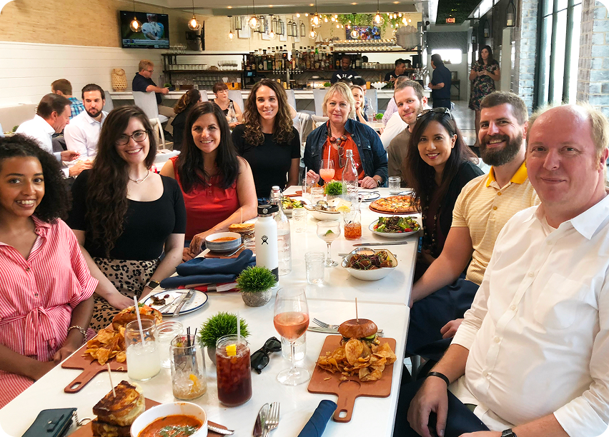 The GRANITE team around a long table at a restaurant lunch